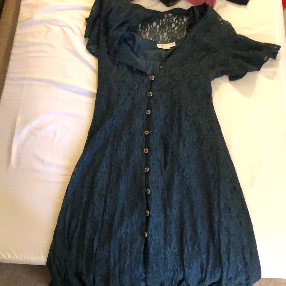 Green dress with goldish buttons